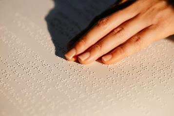 Woman's hand using braille
