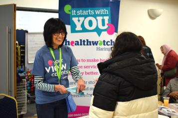 Healthwatch volunteer speaking to a woman