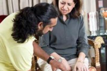 Physiotherapist with an Asian female adult patient